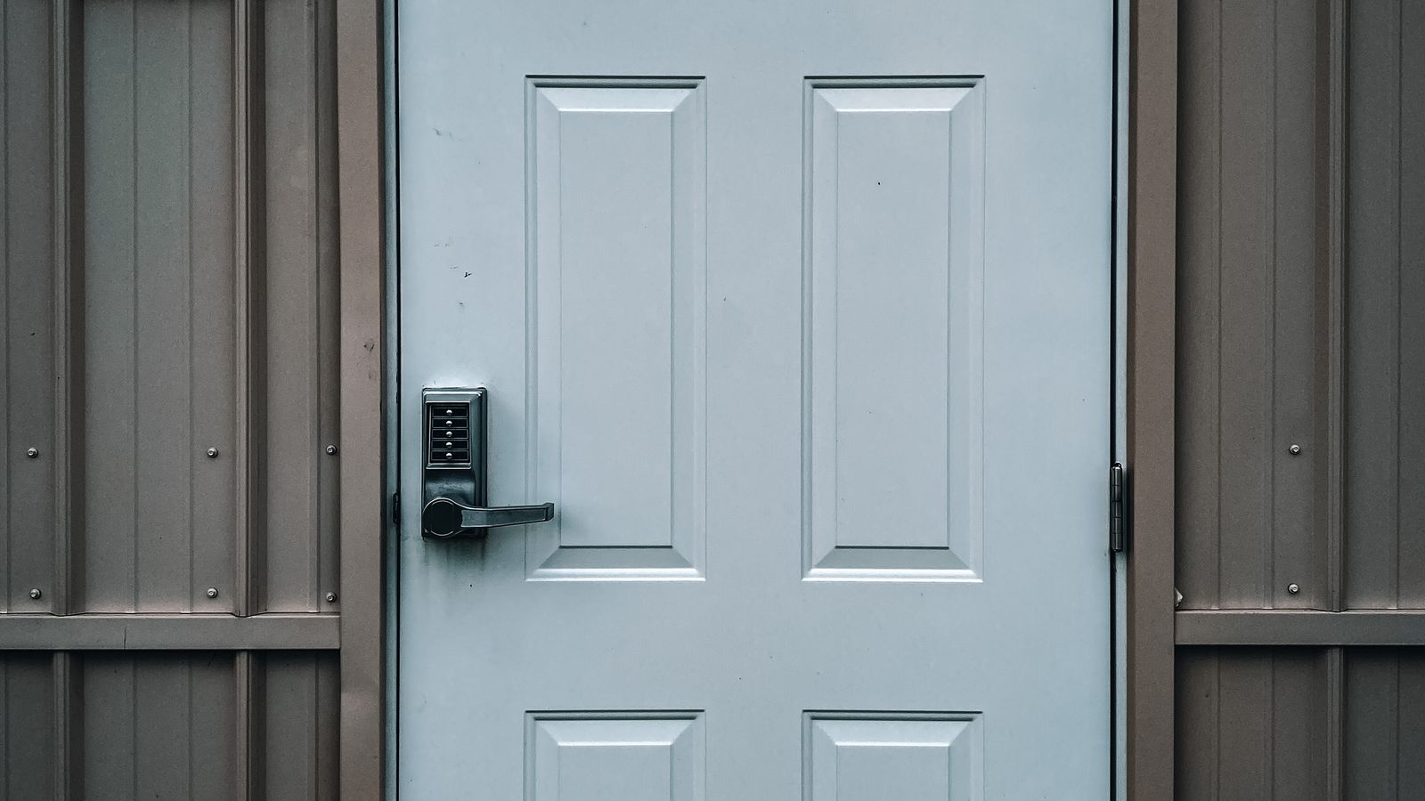 White entry door with an electronic keypad lock